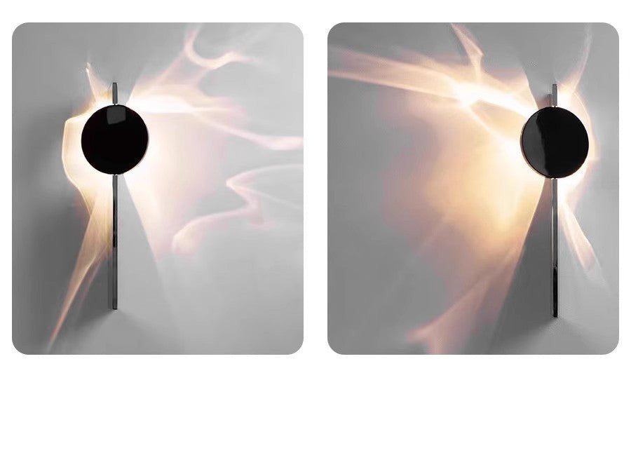 Applique murale Lumeoo STEELIX en inox avec disque noir et effet lumineux ondulé pour une ambiance moderne et douce.