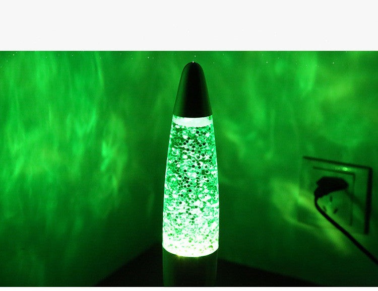 Lampe à lave Lumeoo verte à paillettes avec base en aluminium, idéale pour une ambiance relaxante au salon ou chevet.