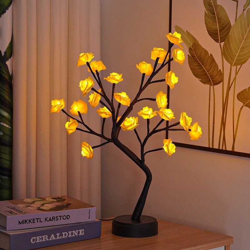 Lampe arbre Lumeoo avec fleurs lumineuses LED jaunes, design décoratif romantique pour chambre sur table en bois.