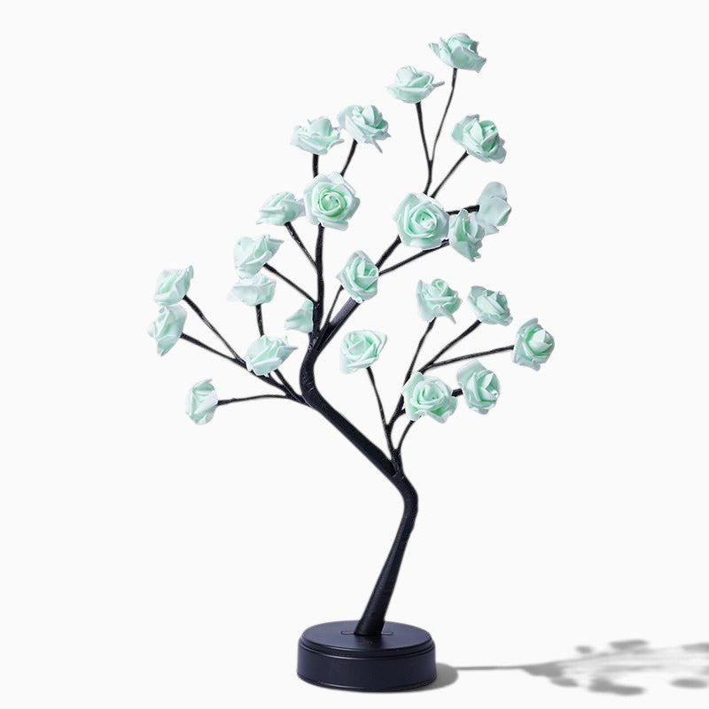 Lampe arbre Lumeoo avec fleurs roses LED vert menthe sur branches noires pour une décoration romantique