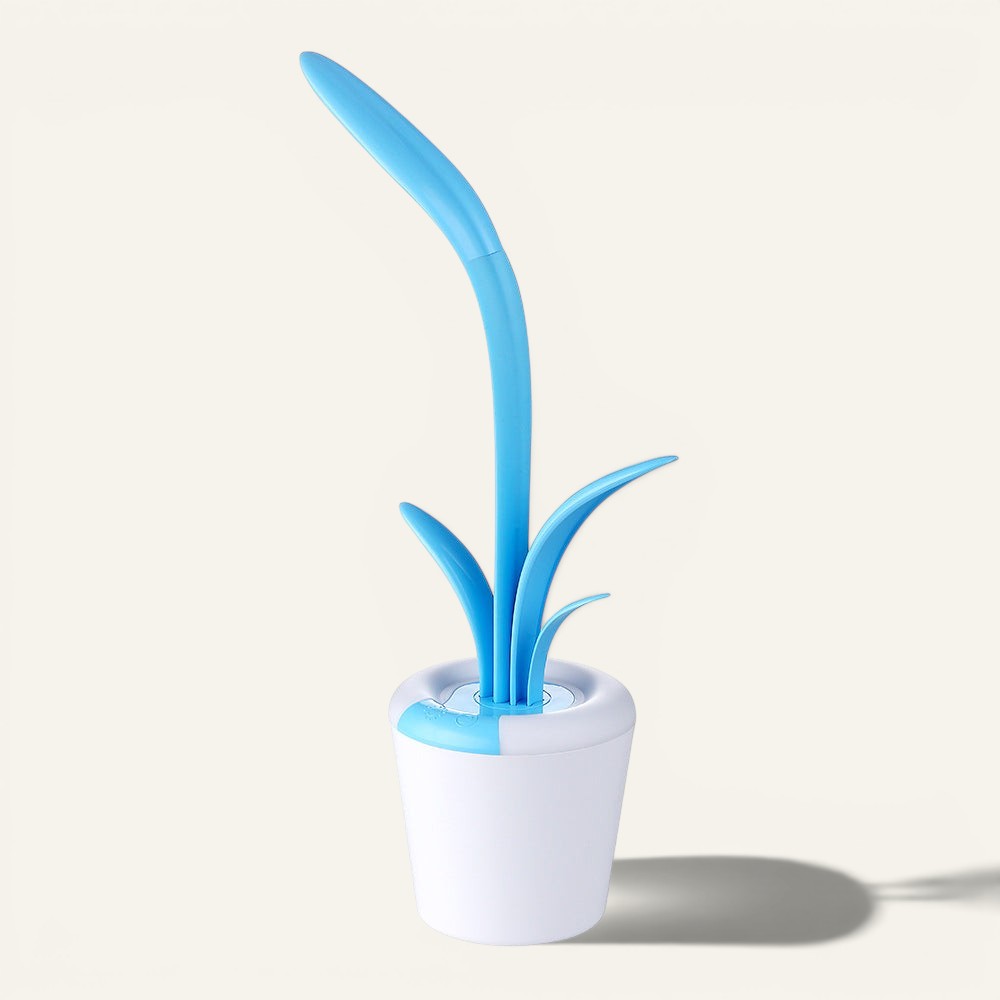 Lampe de bureau Lumeoo VISILEX bleue en forme de plante, LED tactile dimmable avec socle blanc et port USB.
