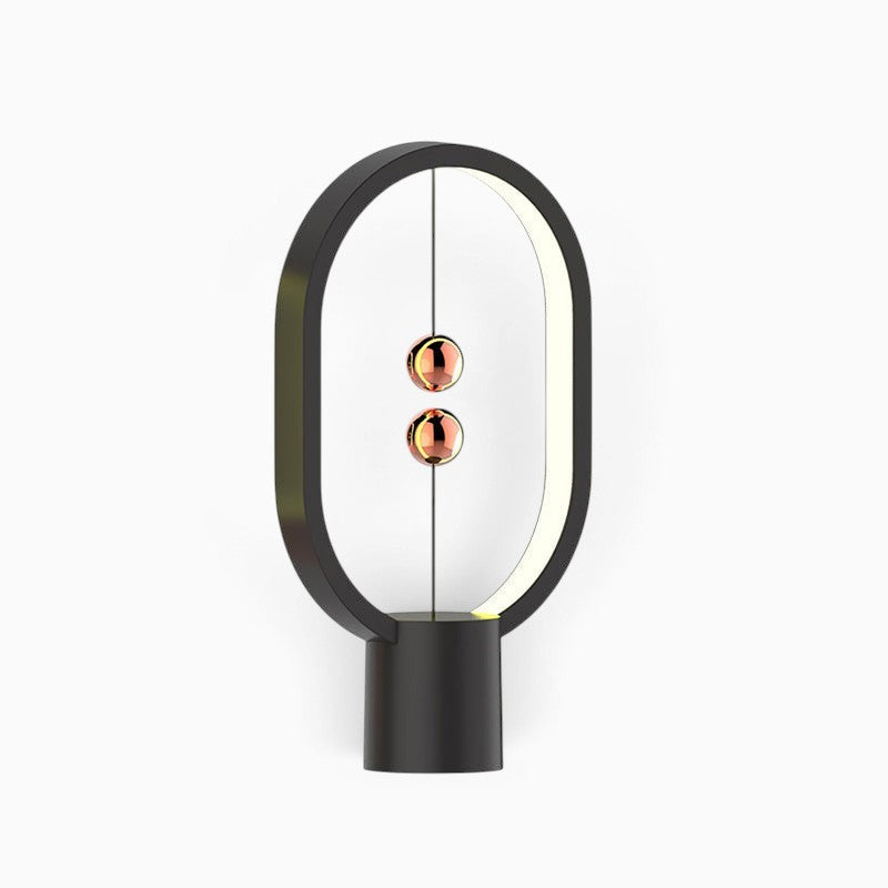 Lampe de chevet Lumeoo design ovale noire avec interrupteur magnétique à billes flottantes cuivrées et éclairage LED
