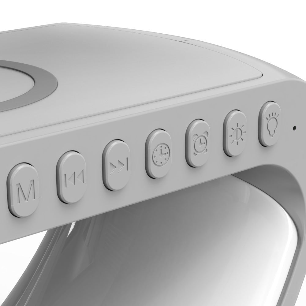 Détail des boutons de contrôle de la lampe Lumeoo AURORIS avec chargeur sans fil et réveil Bluetooth intégré.