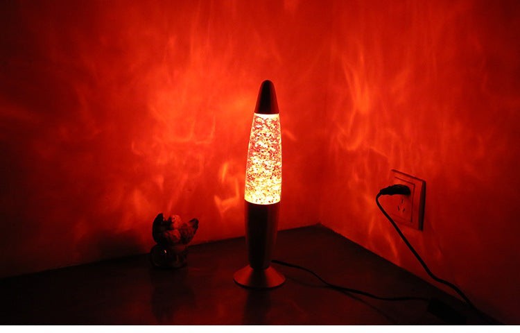 Lampe à lave Lumeoo en aluminium avec paillettes rouges diffusant une lumière d'ambiance relaxante dans une pièce