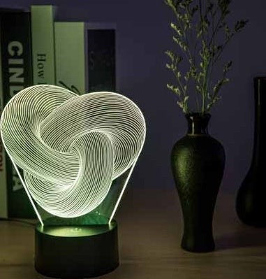 Lampe LED 3D Lumeoo en acrylique avec motif torsadé lumineux, contrôle tactile pour une ambiance apaisante.