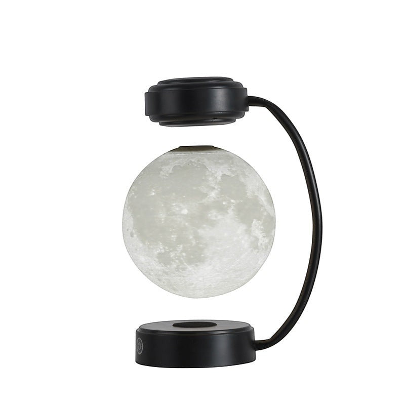 Lampe lune Lumeoo en lévitation magnétique avec base noire, design 3D rotatif pour une ambiance lumineuse apaisante.