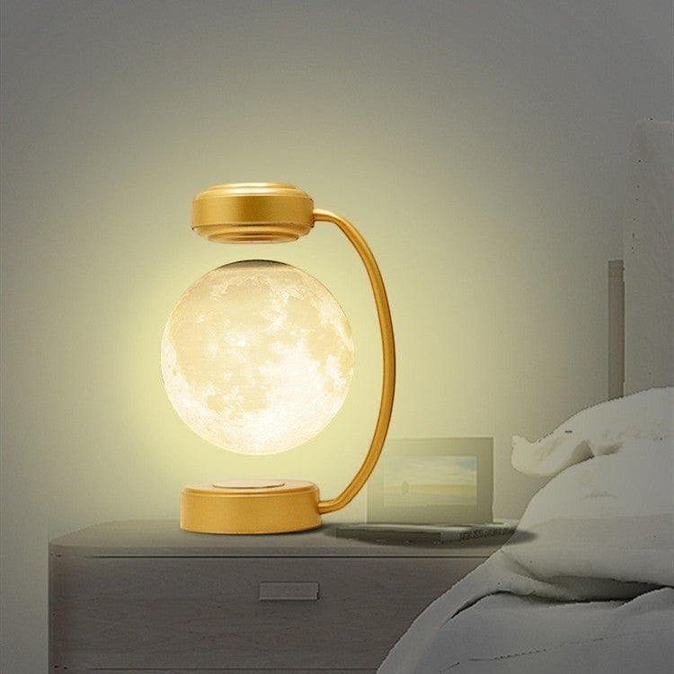 Lampe lune Lumeoo en lévitation magnétique avec base dorée et éclairage LED 3D rotatif pour une ambiance apaisante