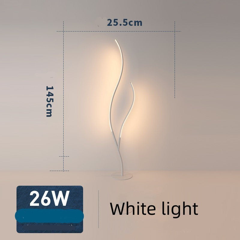 Lampe sur pied Lumeoo au design branche artistique LED blanche diffusant une lumière douce dans un salon contemporain