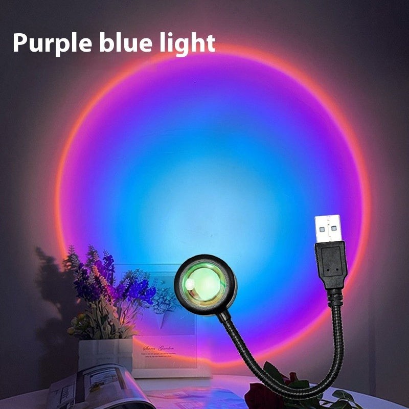 Lampe Lumeoo USB projetant une lumière circulaire dégradée violette et bleue sur un mur pour une ambiance relaxante