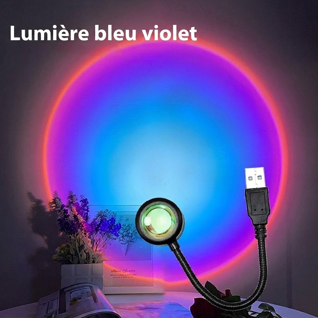 Lampe Lumeoo RAINOVA USB projetant un cercle lumineux aux teintes bleu et violet sur un mur pour une ambiance relaxante