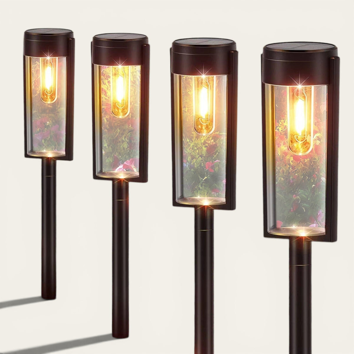 Quatre lampes solaires Lumeoo à piquer avec filament tungstène pour un éclairage extérieur chaleureux et décoratif