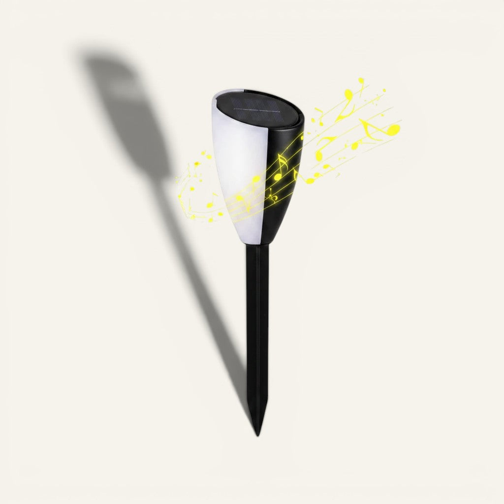 Borne Lumeoo solaire bicolore noire et blanche avec haut-parleur intégré pour jardin, design moderne et élégant.