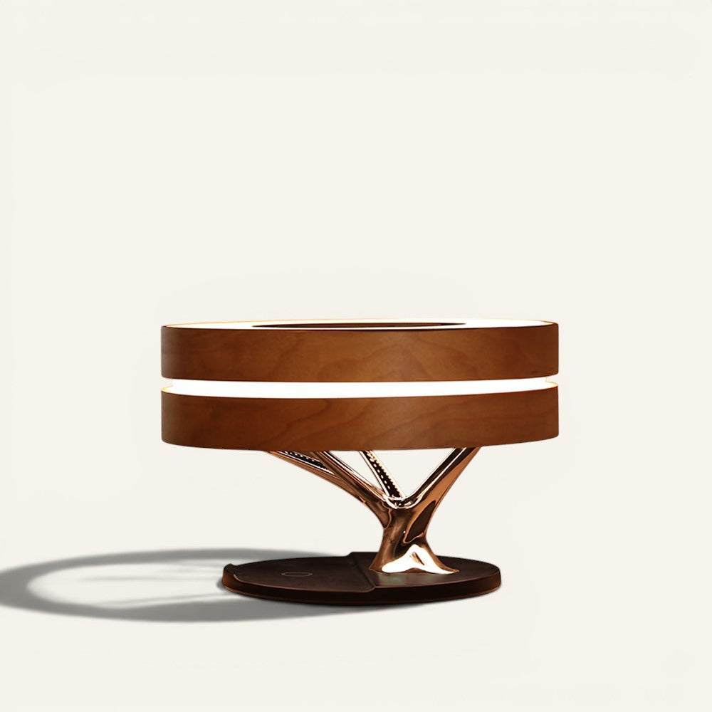 Lampe de table Lumeoo ARBOREA en bois avec enceinte Bluetooth, chargeur induction et design en forme d'arbre lumineux.