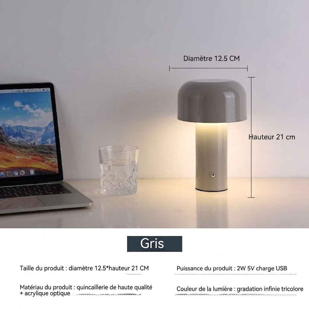 Lampe de table champignon Lumeoo grise tactile avec éclairage LED doux sur un bureau près d'un ordinateur portable