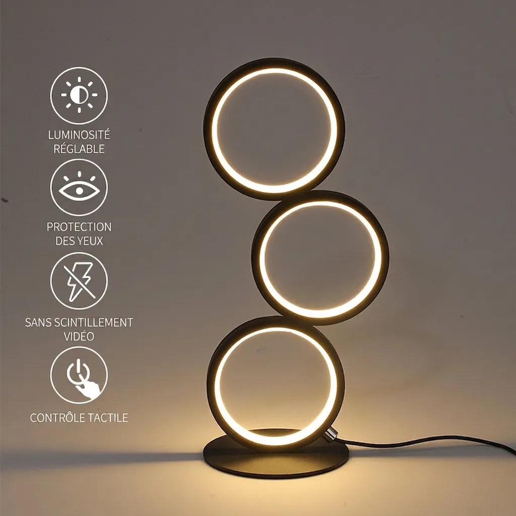 Lampe de table Lumeoo TOUCHLUX noire avec trois anneaux LED tactiles et réglables pour une ambiance lumineuse moderne.