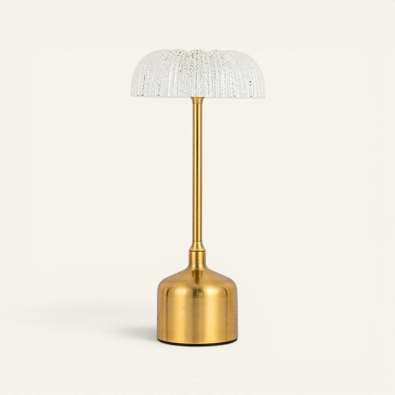 Lampe de table Lumeoo au design vintage avec base en métal doré et abat-jour en verre texturé pour lumière douce