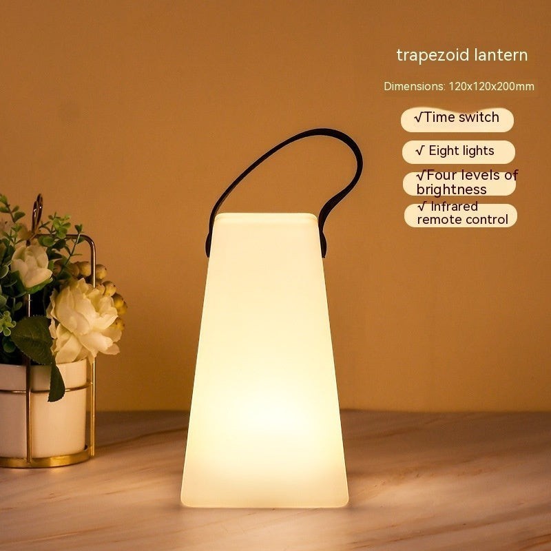 Lanterne de camping LED Lumeoo rechargeable, forme trapézoïdale, 16 couleurs, avec télécommande et poignée noire.