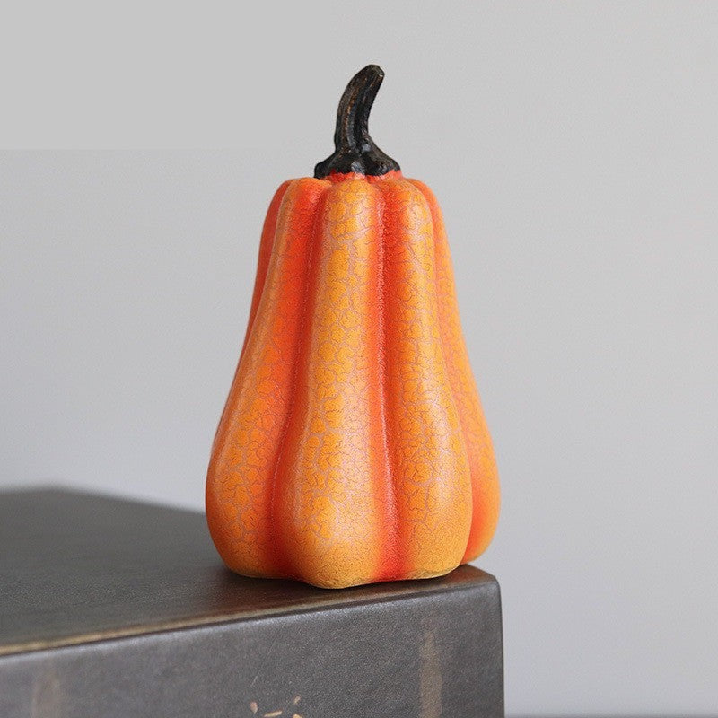 Lanterne citrouille Halloween Lumeoo en résine orange avec finition texturée, idéale pour une décoration lumineuse.