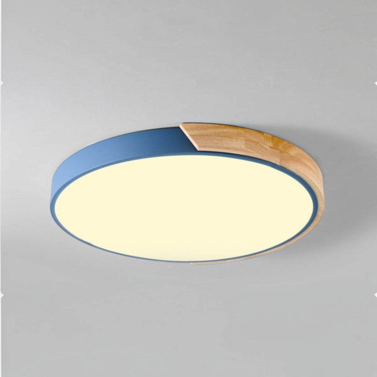 Plafonnier LED rond Lumeoo style nordique avec bordure bleue et détail en bois clair pour une lumière douce