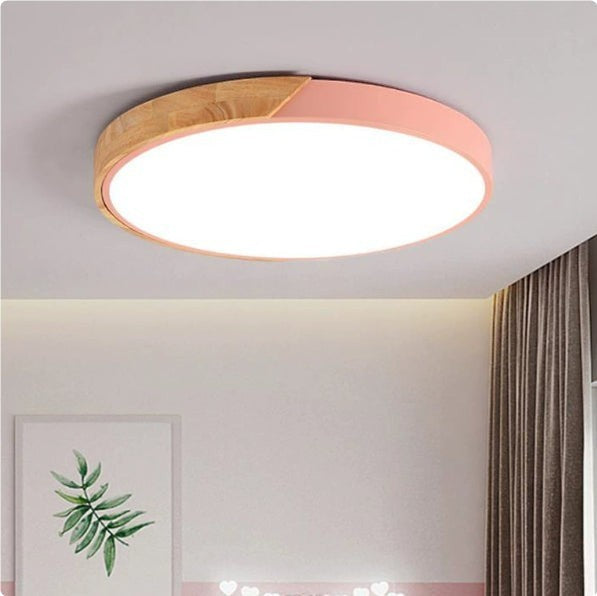 Plafonnier LED rond Lumeoo style nordique avec finition bois et bordure rose pastel pour une ambiance douce