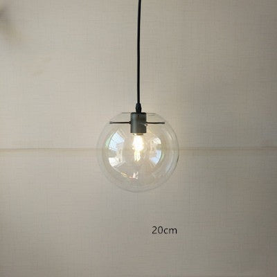 Suspension luminaire boule en verre transparent Lumeoo avec monture noire pour un éclairage élégant et moderne