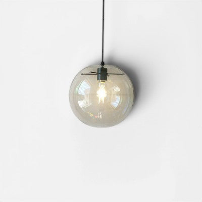 Suspension luminaire boule en verre transparent Lumeoo au design épuré pour un éclairage doux et élégant