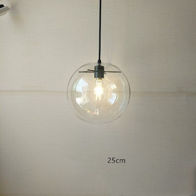 Suspension luminaire boule en verre transparent Lumeoo au design épuré pour un éclairage doux et élégant