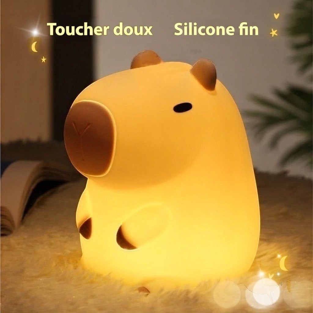 Veilleuse Lumeoo en silicone souple en forme de capybara diffusant une lumière douce et chaleureuse pour enfant