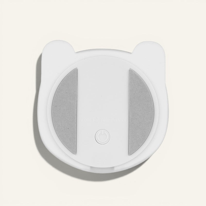 Base blanche en silicone de la veilleuse lapin Lumeoo avec bouton d'alimentation et patins antidérapants gris
