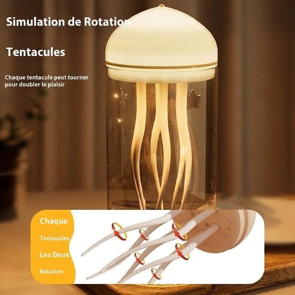 Veilleuse méduse LED Lumeoo avec dôme lumineux et tentacules rotatifs dans un cylindre gravé d'étoiles et de lunes