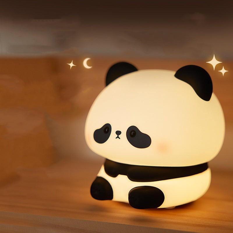 Veilleuse Lumeoo en silicone en forme de panda diffusant une lumière douce et apaisante pour la chambre d'enfant